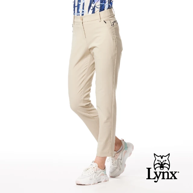 Lynx Golf 女款日本進口布料抗UV接觸冷感機能織帶剪接設計草寫繡花造型窄管九分褲(卡其色)