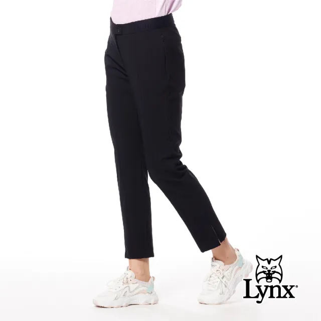 【Lynx Golf】女款日本進口布料彈性舒適隱形拉鍊口袋設計褲口開杈造型窄管九分褲(黑色)