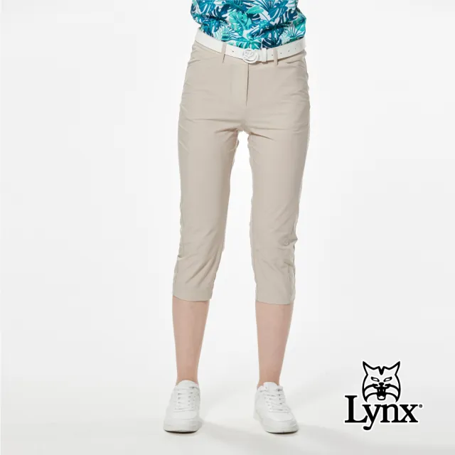 【Lynx Golf】女款彈性舒適後腰鬆緊帶設計經典山貓貓頭貼膜造型窄管七分褲(二色)
